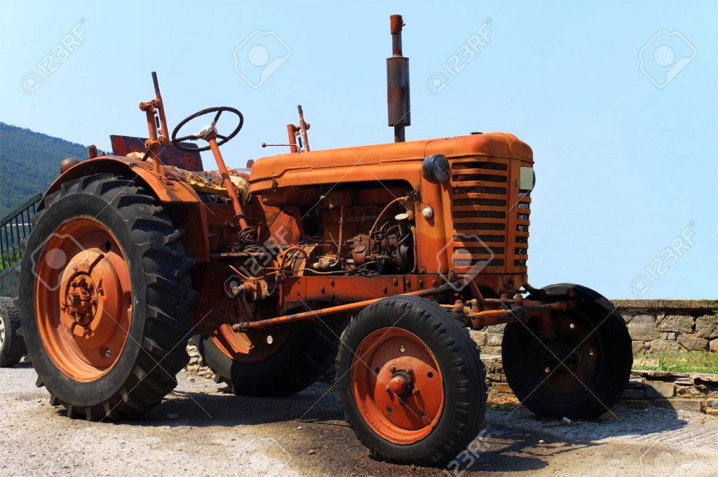 58aca2b4a0a02_28281336-Un-vieux-tracteur-orange-image-HDR--Banque-dimages.thumb.jpg.a5af9d100f808288dd29e55c116250f3.jpg